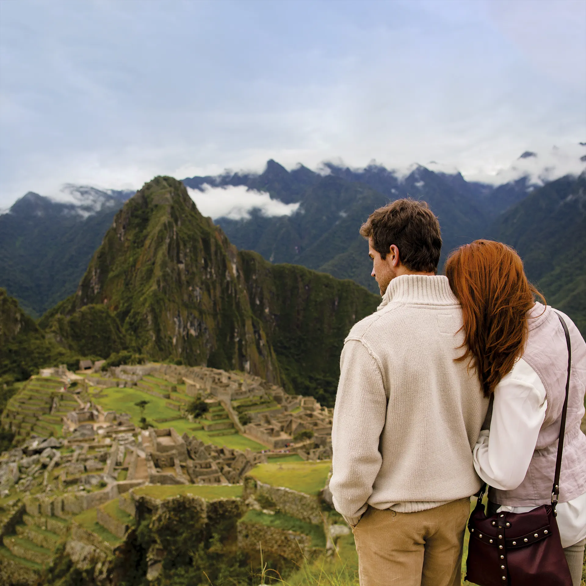 Modern traveler looking at mountains
